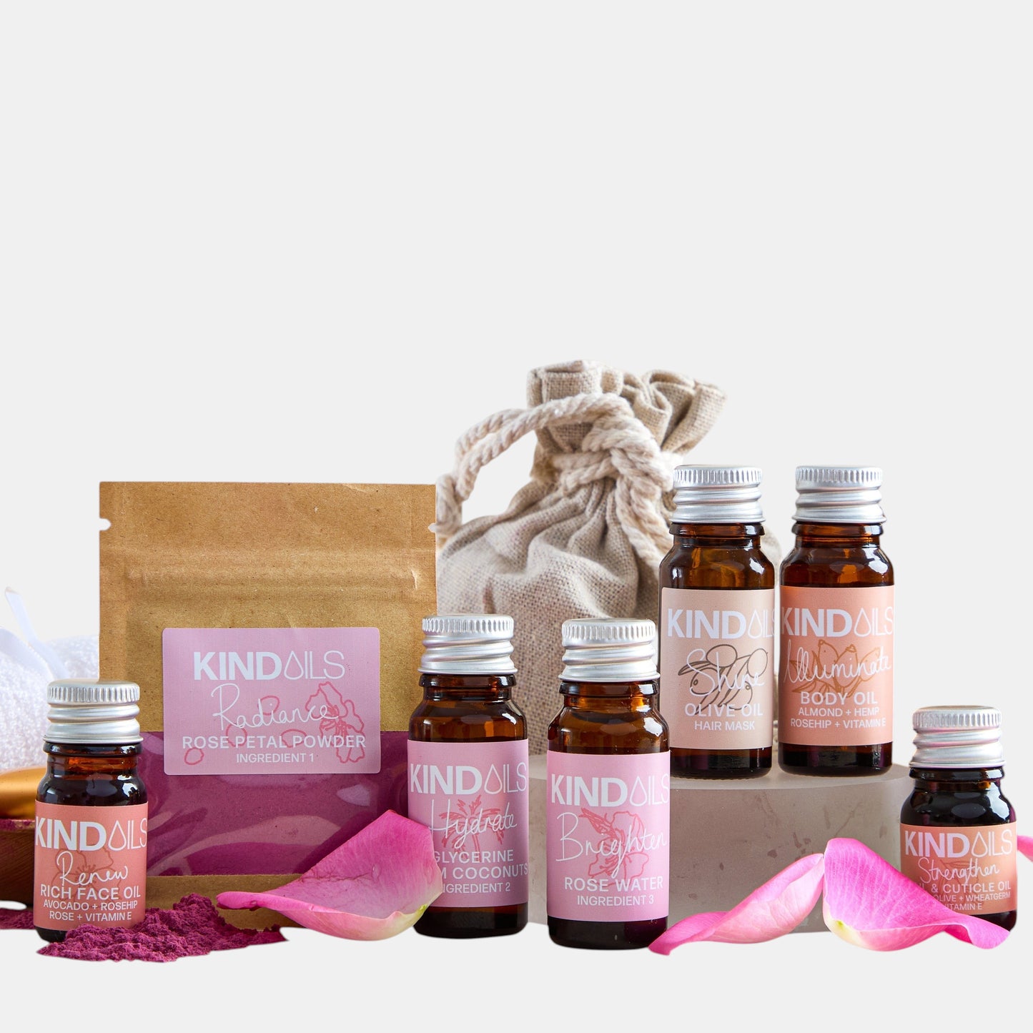 Collection of Kindals skincare products including bottles and a bag on a white background